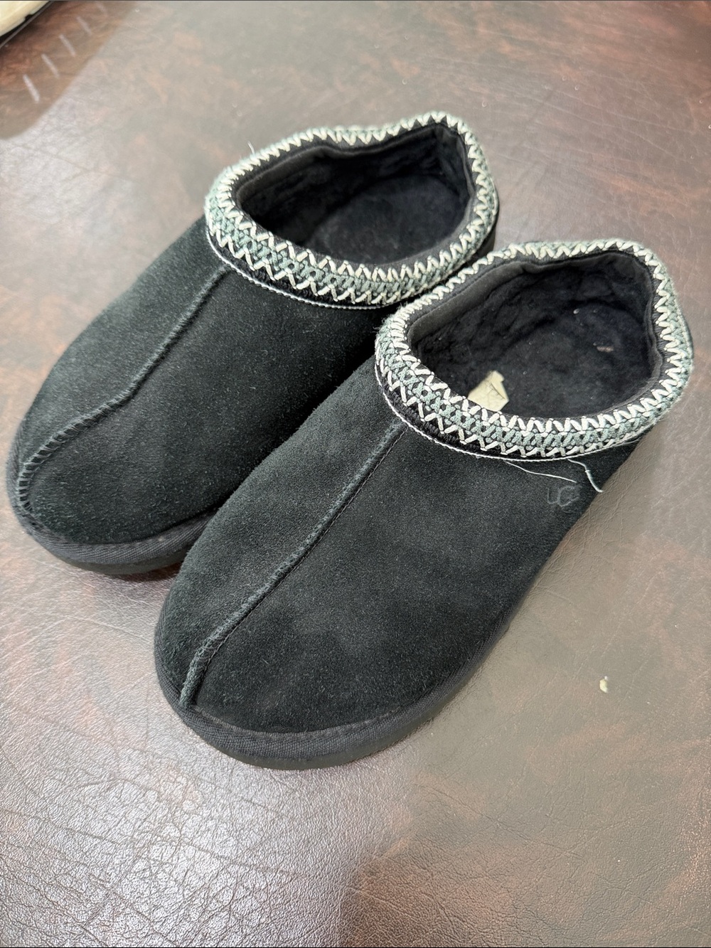 UGG Black Suede Slip-On Moccasin Slippers with Braided Trim